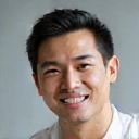 Professional portrait of David Chen, a satisfied client